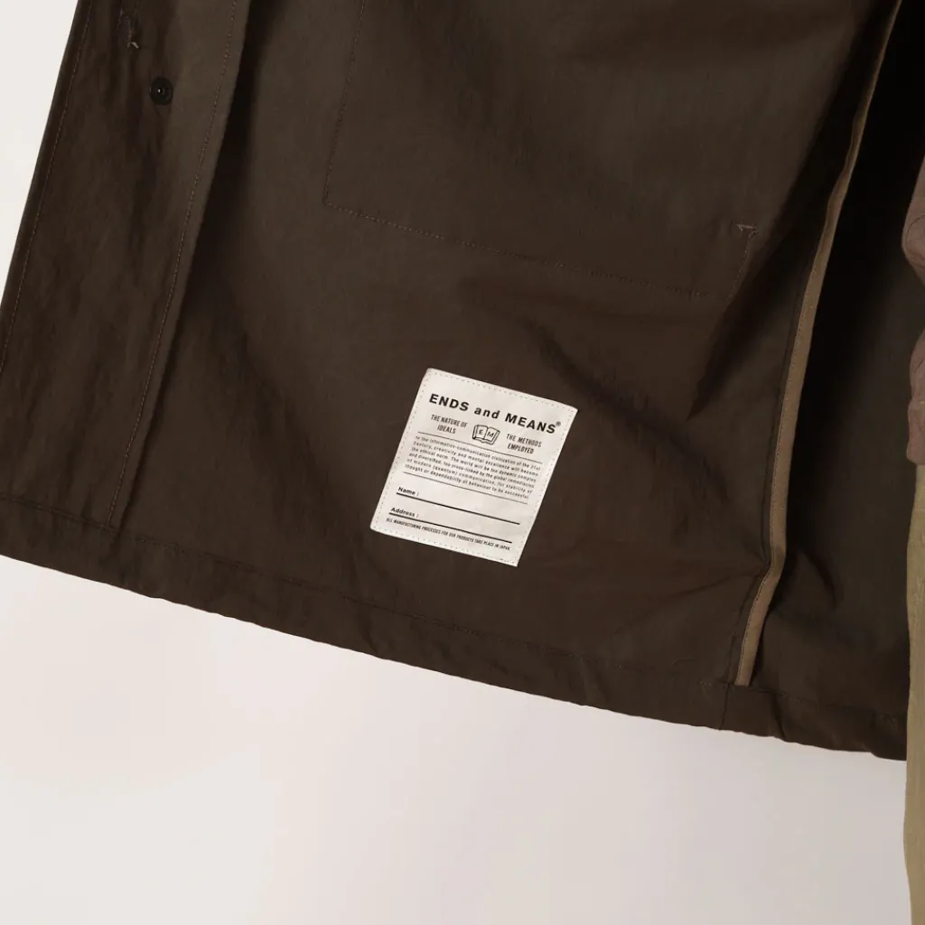 Jackets|Ends and Means Travel Half Parka - African Black